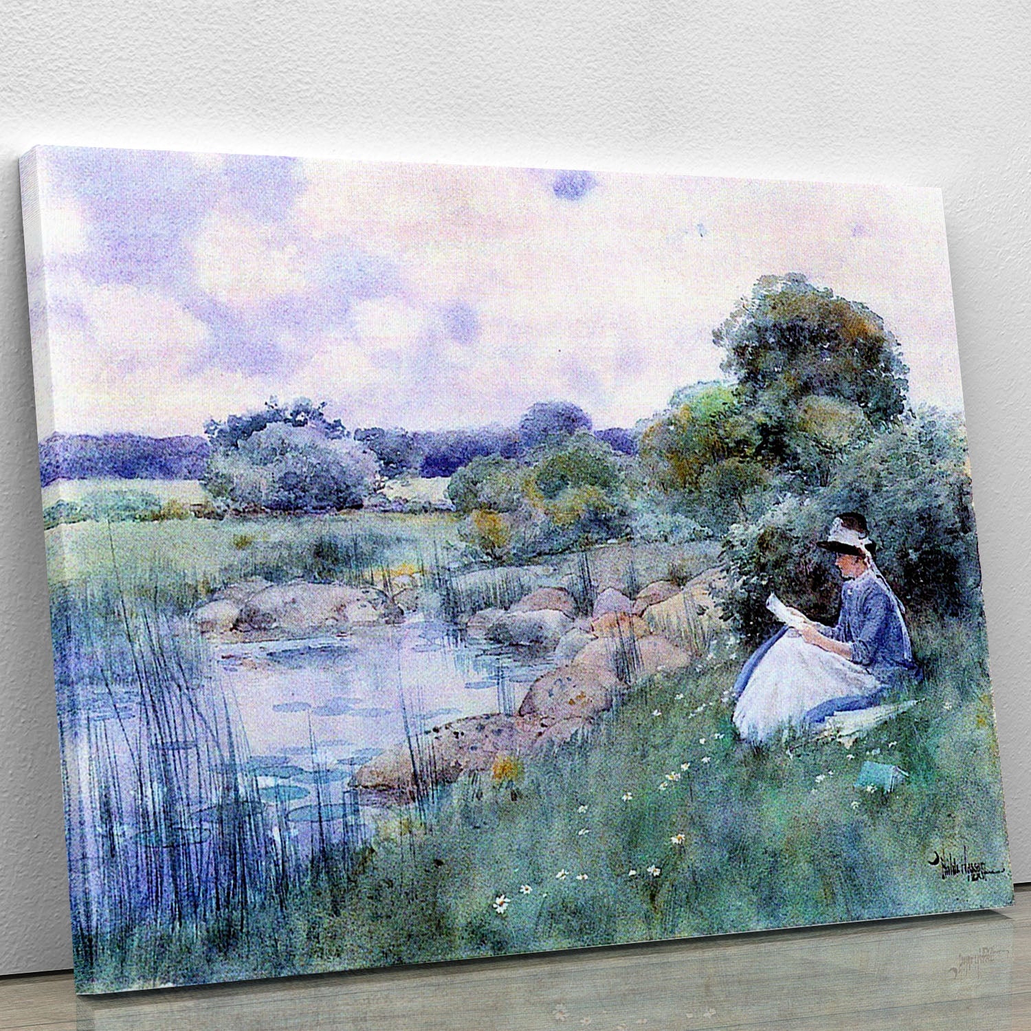 Canvas print of a woman reading, showcasing serene and elegant artwork by Hassam.