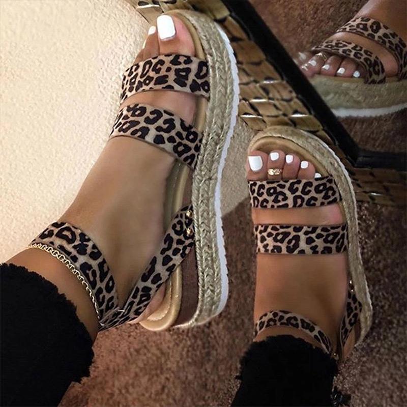 Stylish leopard print women sandals with flat platform and buckle strap, perfect for summer outings.