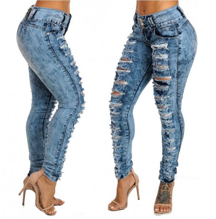 A pair of women's slim fit jeans featuring stylish ripped holes, made from high-quality denim with a light wash.