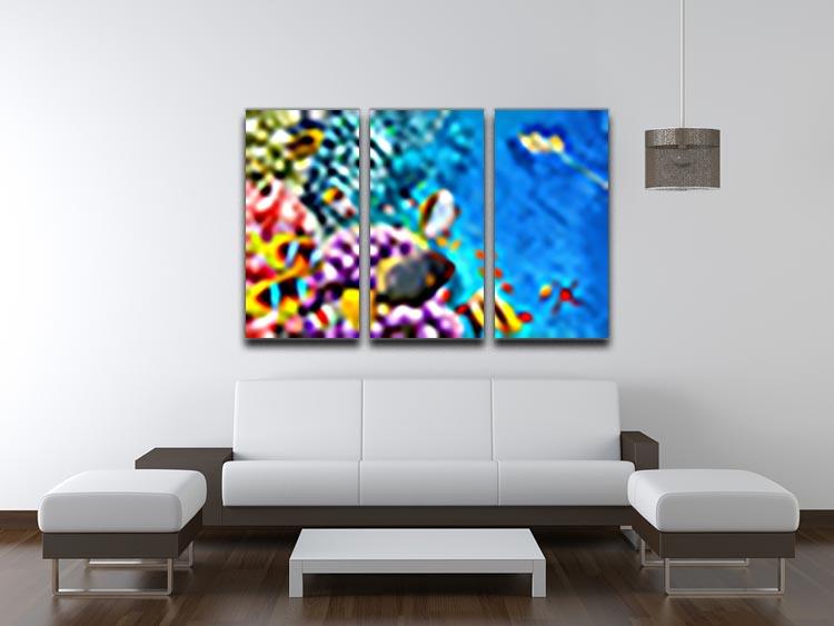 A beautiful 3-panel canvas print featuring vibrant corals and tropical fish, perfect for home decor.