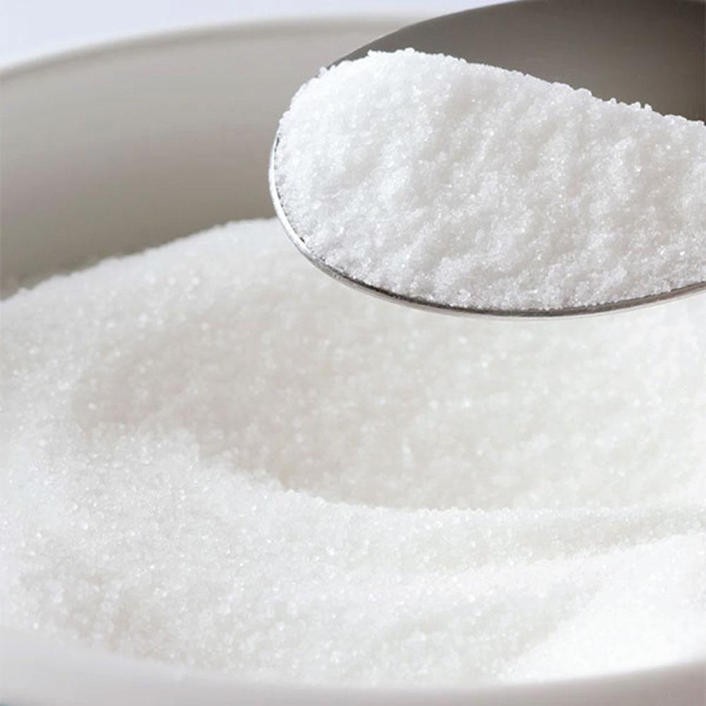 A bag of Xylitol Crystal Powder, a natural sweetener, showcasing its white crystalline texture and resealable packaging.