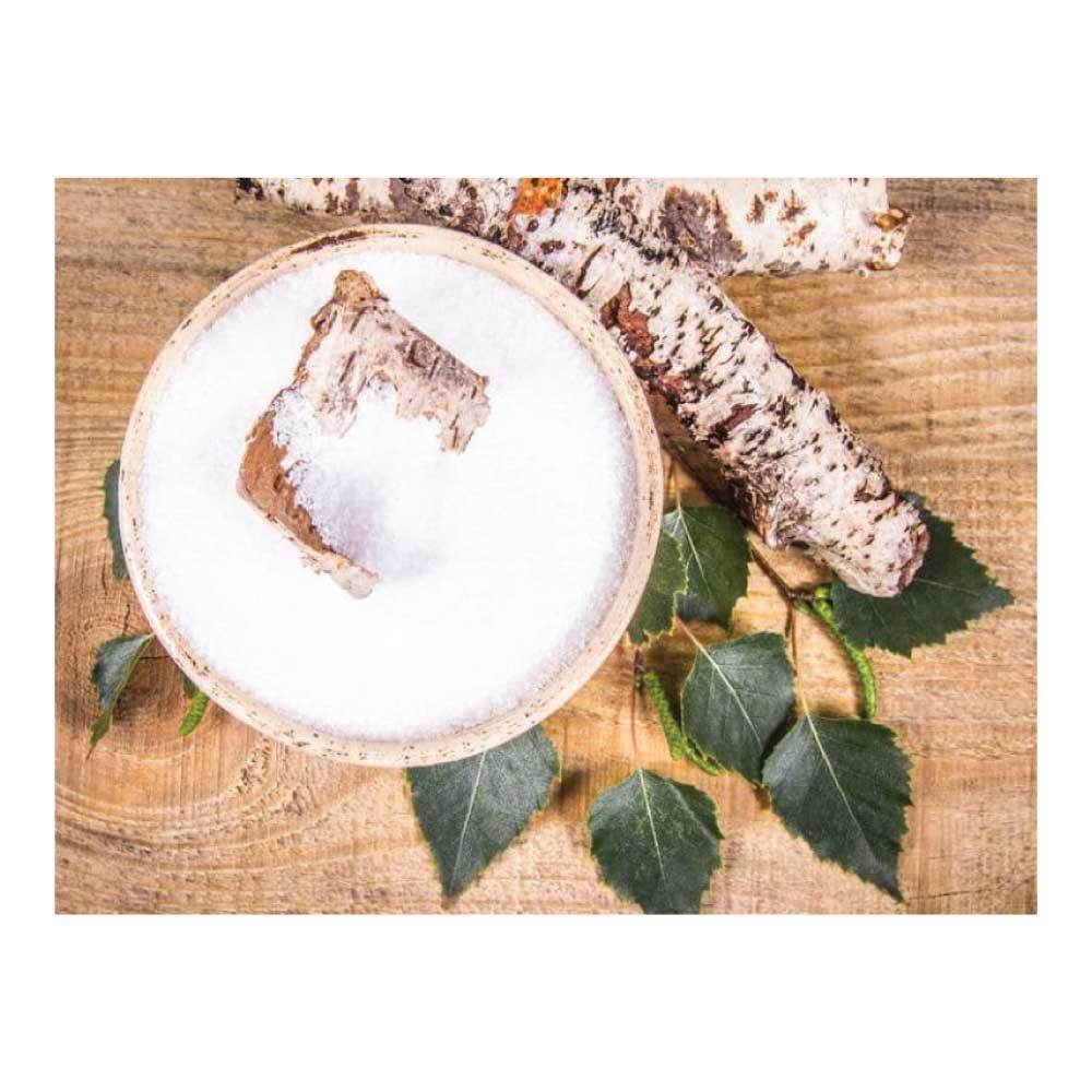 A bag of Xylitol Crystal Powder, a natural sweetener, showcasing its white crystalline texture and resealable packaging.