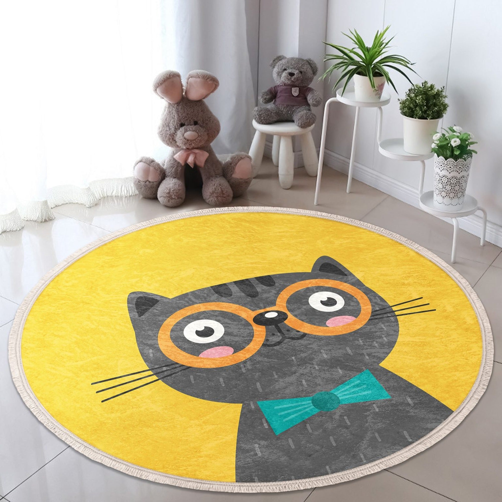 A vibrant yellow round rug featuring playful cat patterns, perfect for kids' rooms and nurseries.