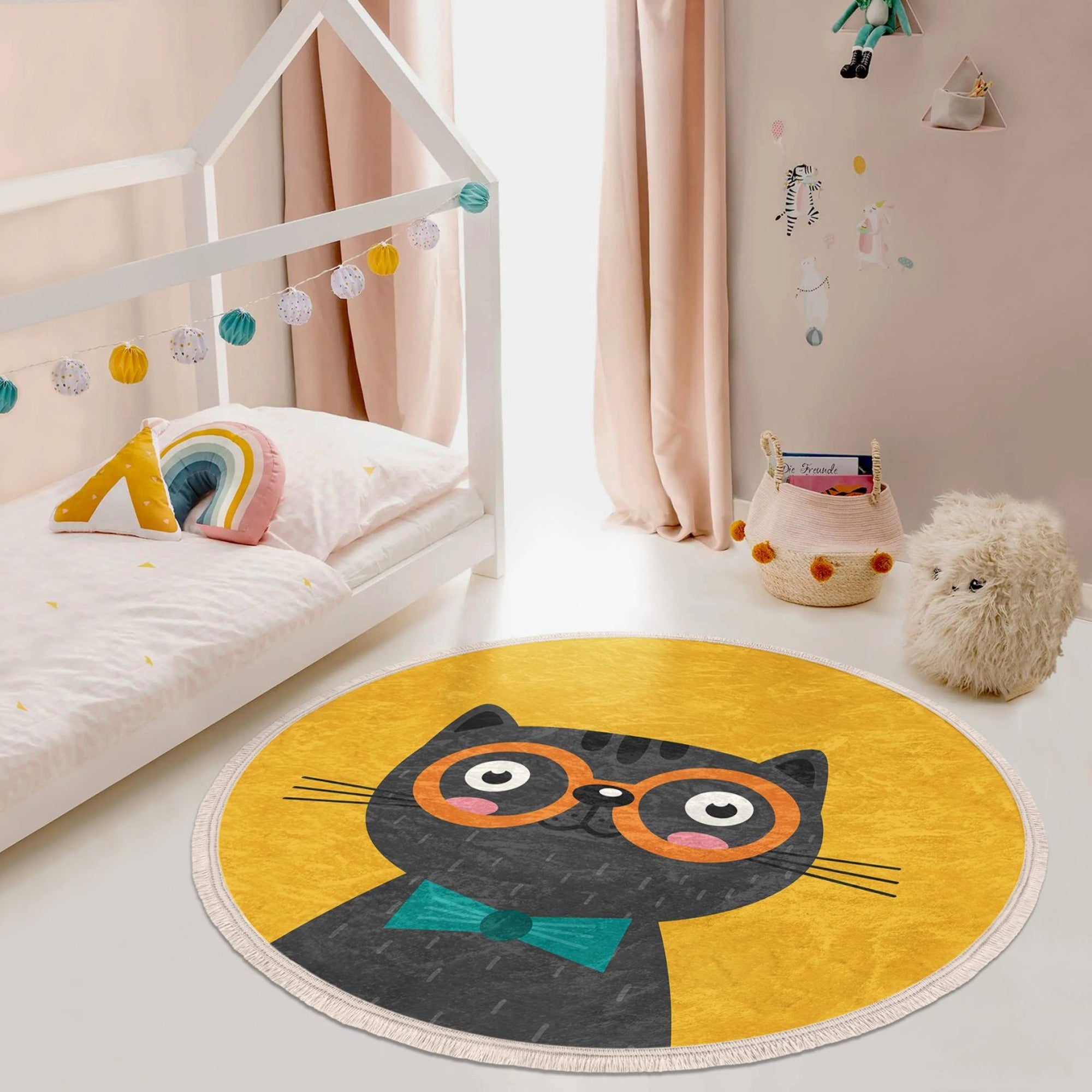 A vibrant yellow round rug featuring playful cat patterns, perfect for kids' rooms and nurseries.