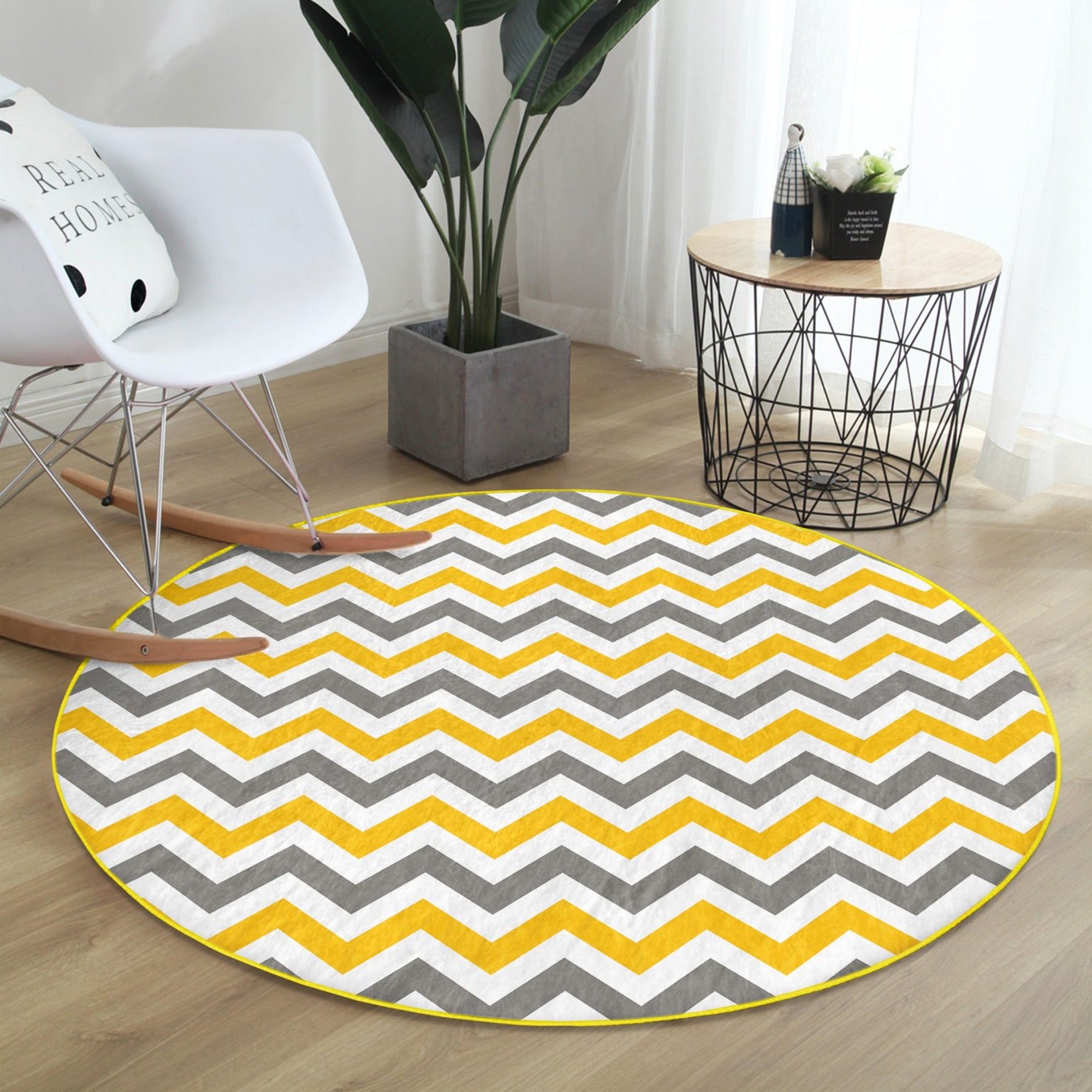 A beautifully designed yellow, gray, and white patterned round rug, showcasing its soft velvet texture and modern aesthetic.