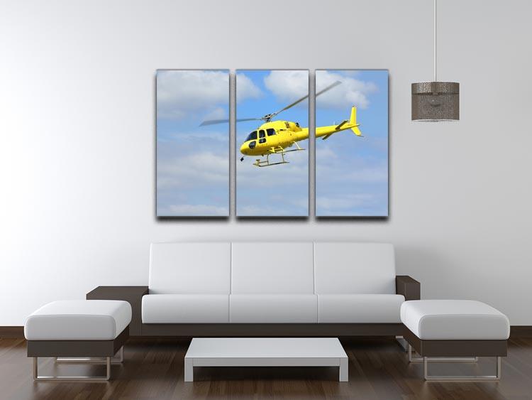 A vibrant yellow helicopter soaring in the air, depicted in a stunning 3-panel canvas print, perfect for home or office decor.