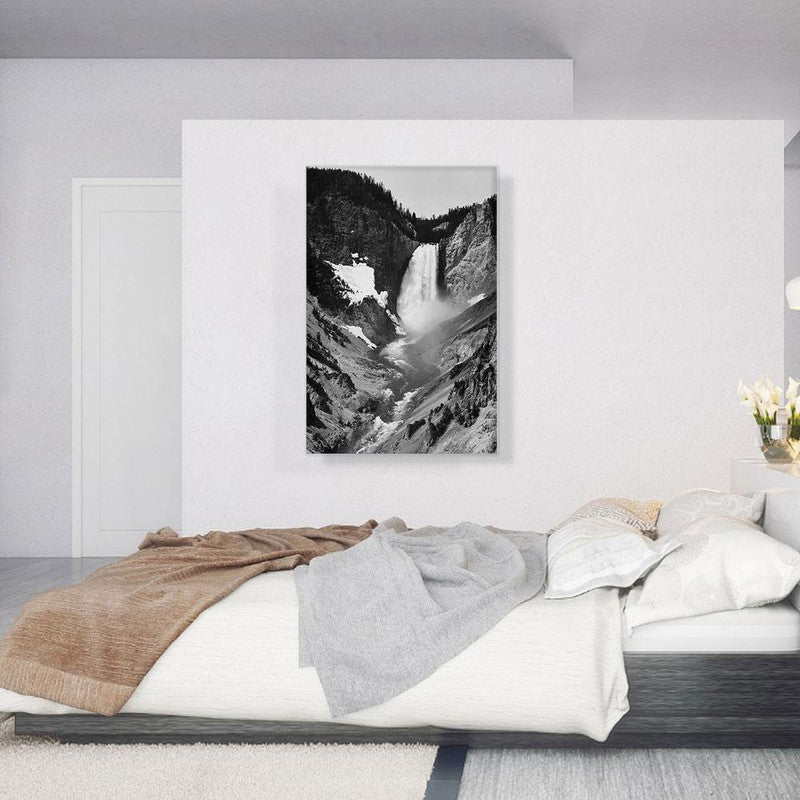 A stunning canvas print of Yellowstone Falls, showcasing the majestic waterfall surrounded by lush greenery and vibrant blue skies.