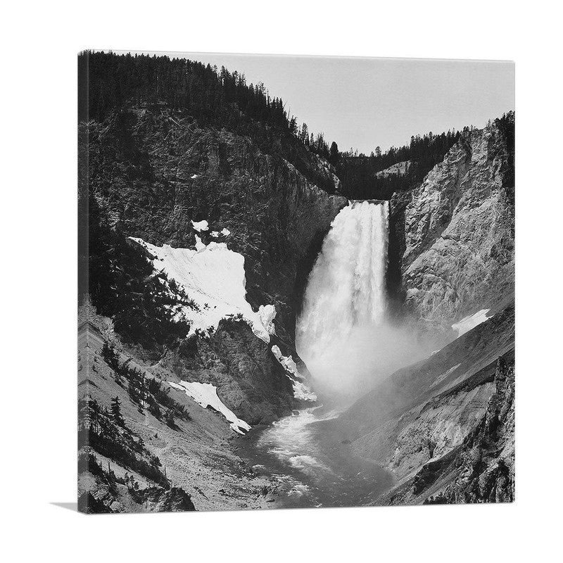 A stunning canvas print of Yellowstone Falls in Wyoming, showcasing the vibrant colors and majestic beauty of the waterfall surrounded by lush greenery.