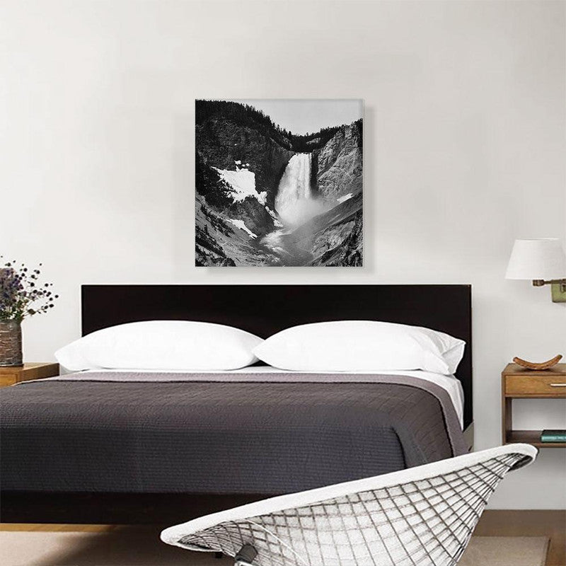 A stunning canvas print of Yellowstone Falls in Wyoming, showcasing the vibrant colors and majestic beauty of the waterfall surrounded by lush greenery.