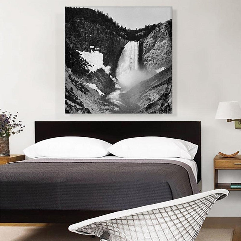 A stunning canvas print of Yellowstone Falls in Wyoming, showcasing the vibrant colors and majestic beauty of the waterfall surrounded by lush greenery.