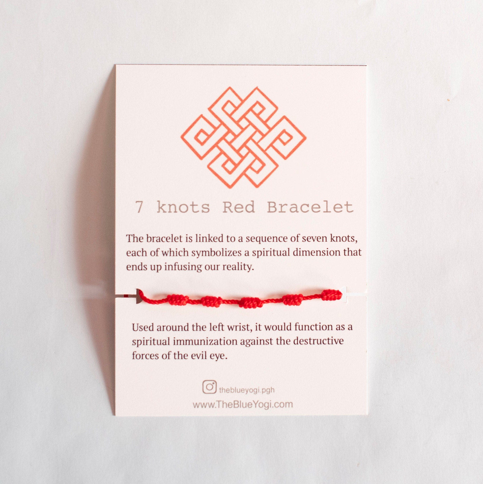 A vibrant red adjustable bracelet featuring seven knots, symbolizing protection and good luck, suitable for both men and women.