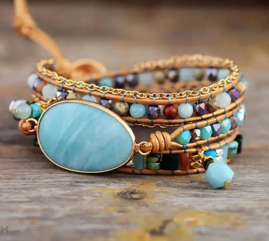 A handmade Amazonite Statement Wrap Bracelet featuring unique semi-precious beads and a leather wrap, showcasing earthy tones and bohemian style.