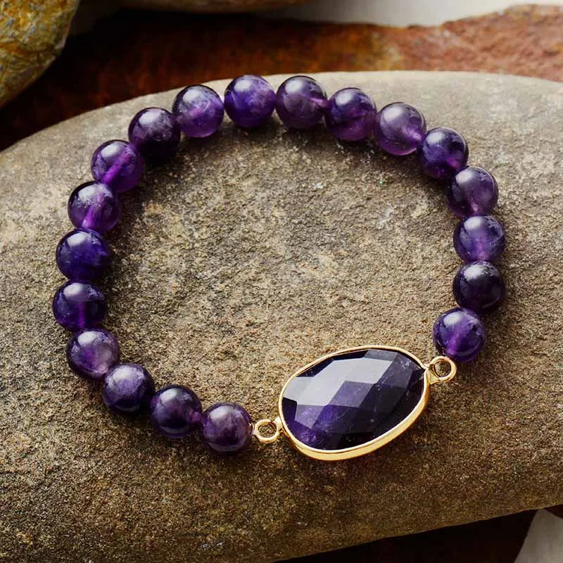 Handmade Amethyst Beaded Elastic Bracelet featuring natural Amethyst stones with a central larger stone, showcasing a unique bohemian style.