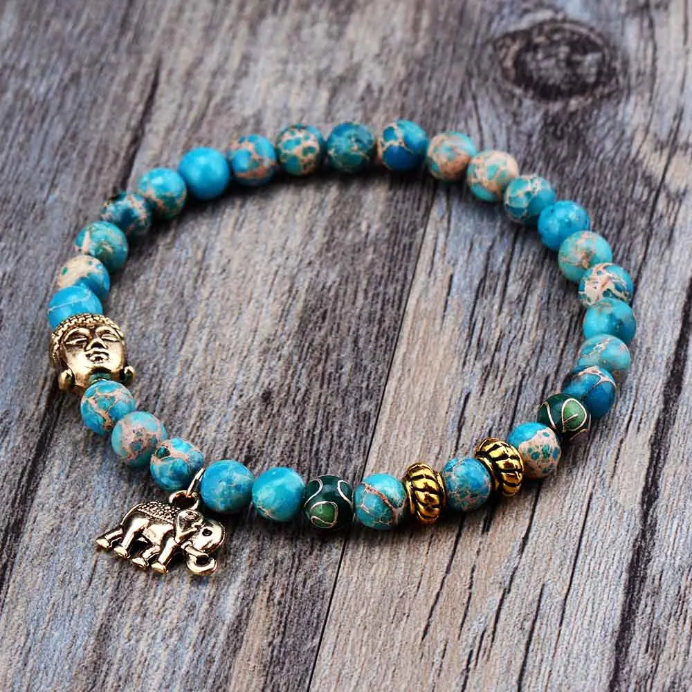 A handmade Elephant & Buddha Meditation Charm Bracelet featuring natural 6mm stone beads and zinc alloy charms, perfect for spiritual wear.