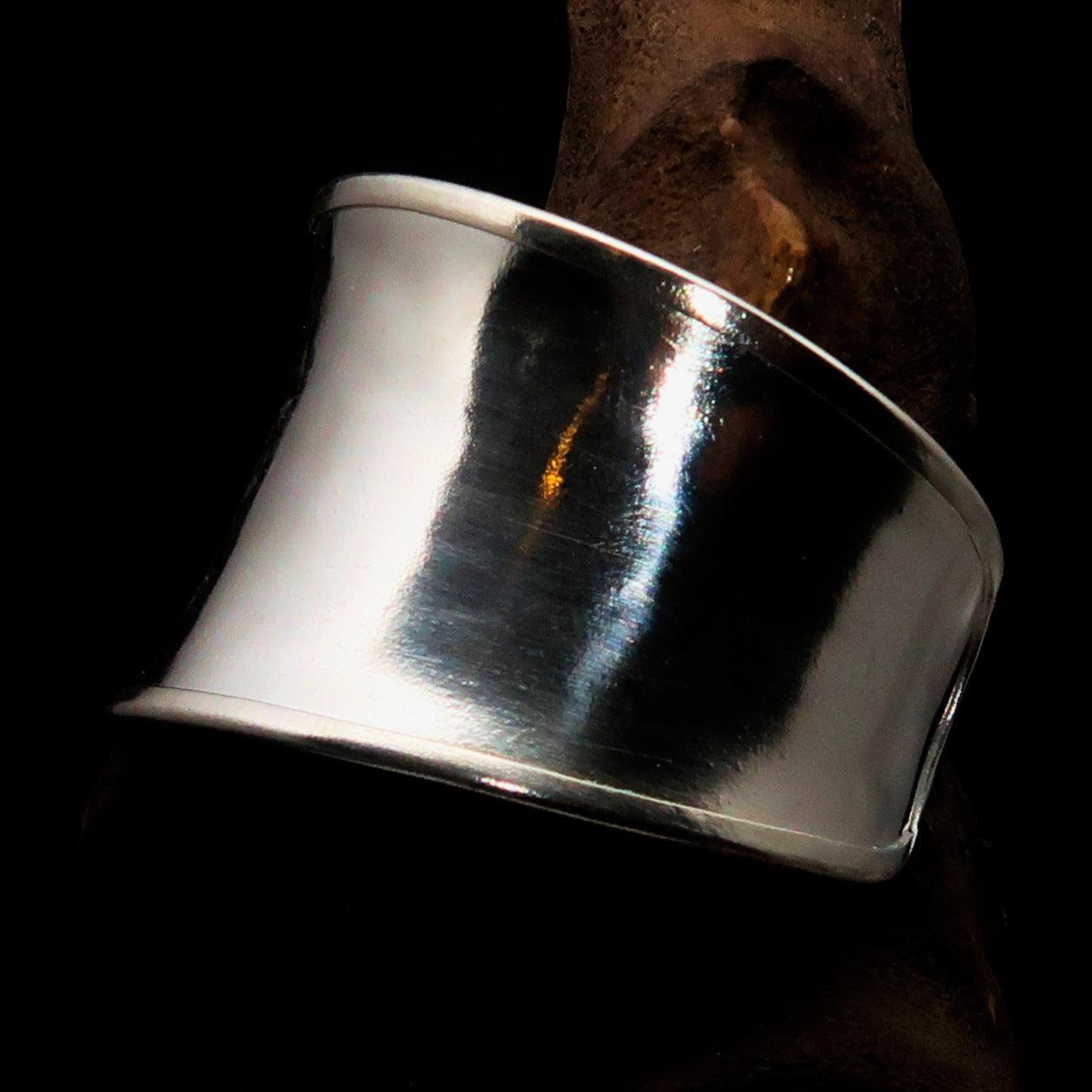 A beautifully handcrafted extra wide sterling silver bracelet, hallmarked 925, showcasing its elegant design and comfortable fit.