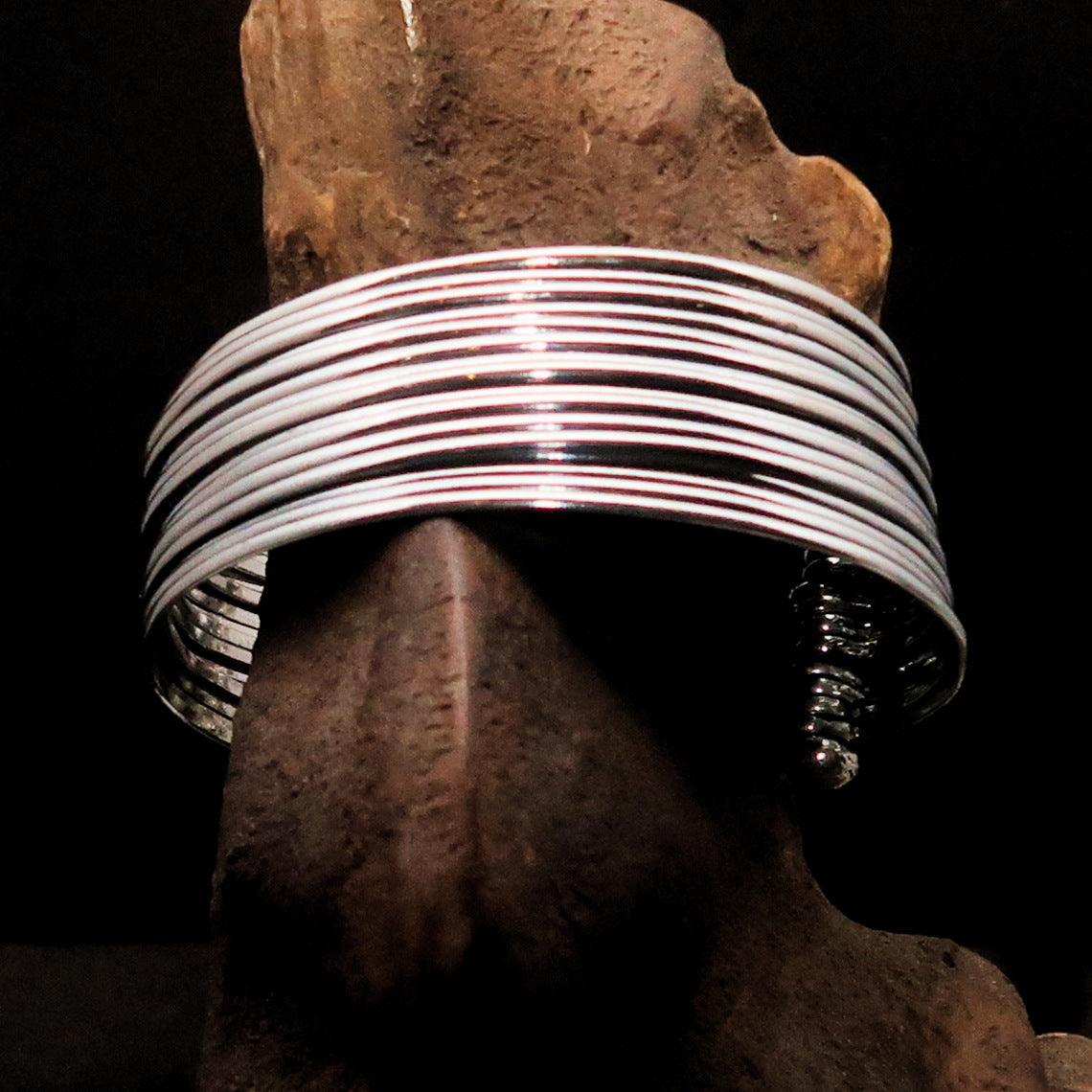 A beautifully handcrafted minimalistic 16 String Sterling Silver Bracelet showcasing its flexible design and hallmark 925.