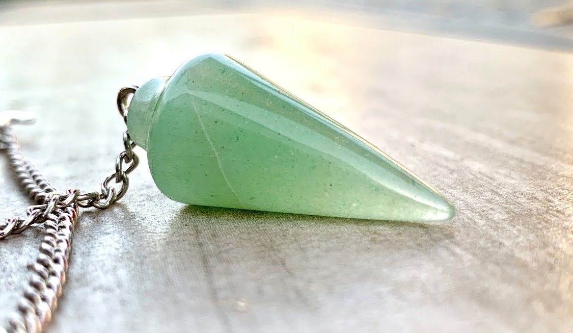A beautiful Green Aventurine Dowsing Pendulum and Bracelet, showcasing its vibrant green color and smooth finish, perfect for dowsing and emotional healing.