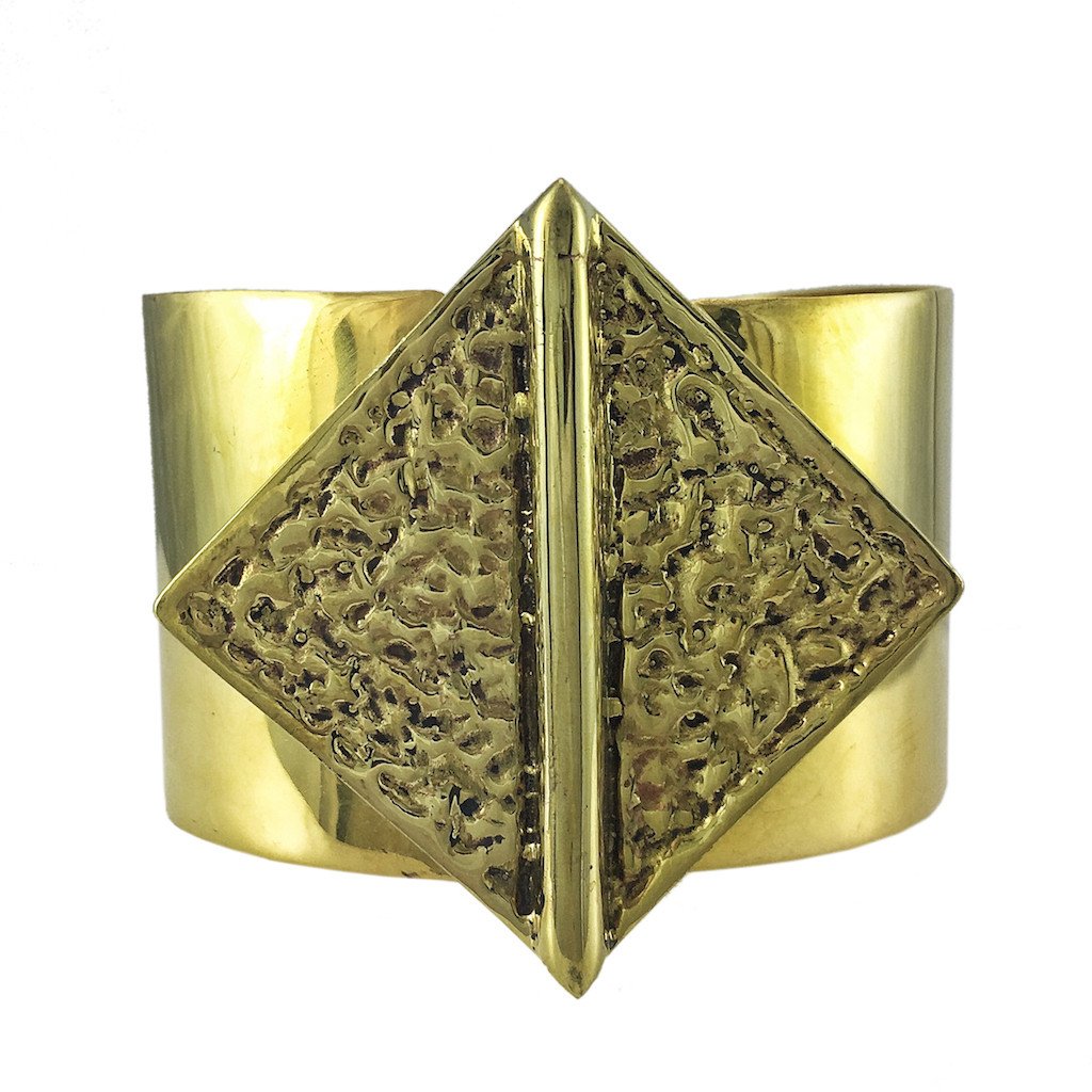 Hammered Bombshell Cuff made from recycled brass bombshells, showcasing a unique hammered design, adjustable for any wrist size.