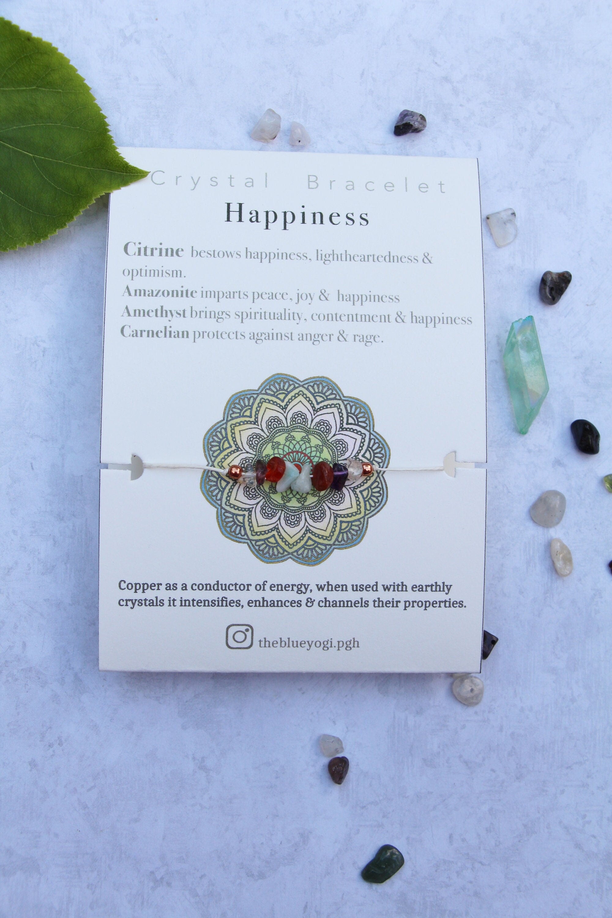Happiness crystal bracelet featuring natural gemstones with a tie closure, displayed with a watercolor Mandala art card.