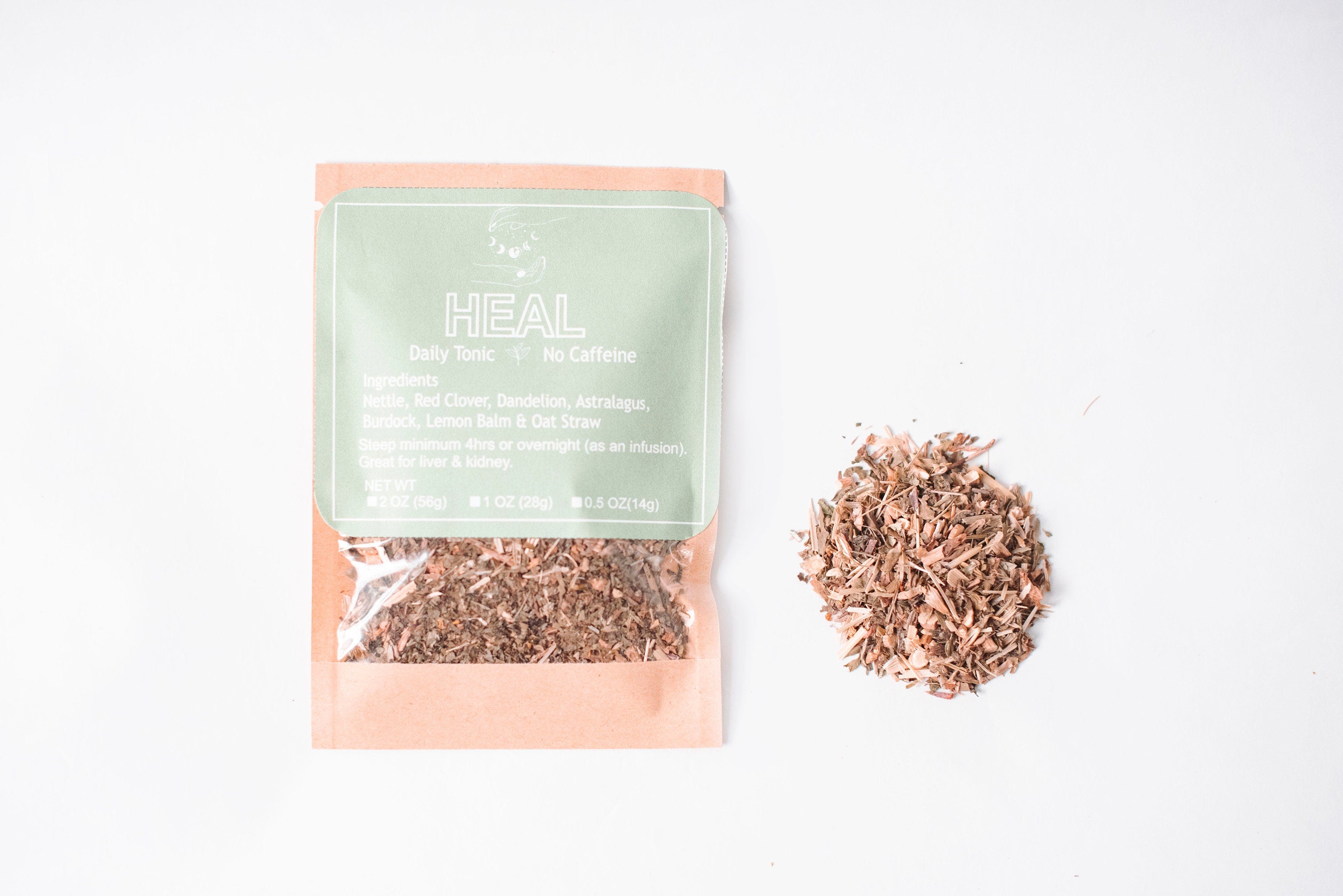 A selection of Heal Herbal Tea loose leaf packs in various sizes, showcasing the vibrant herbs and packaging.