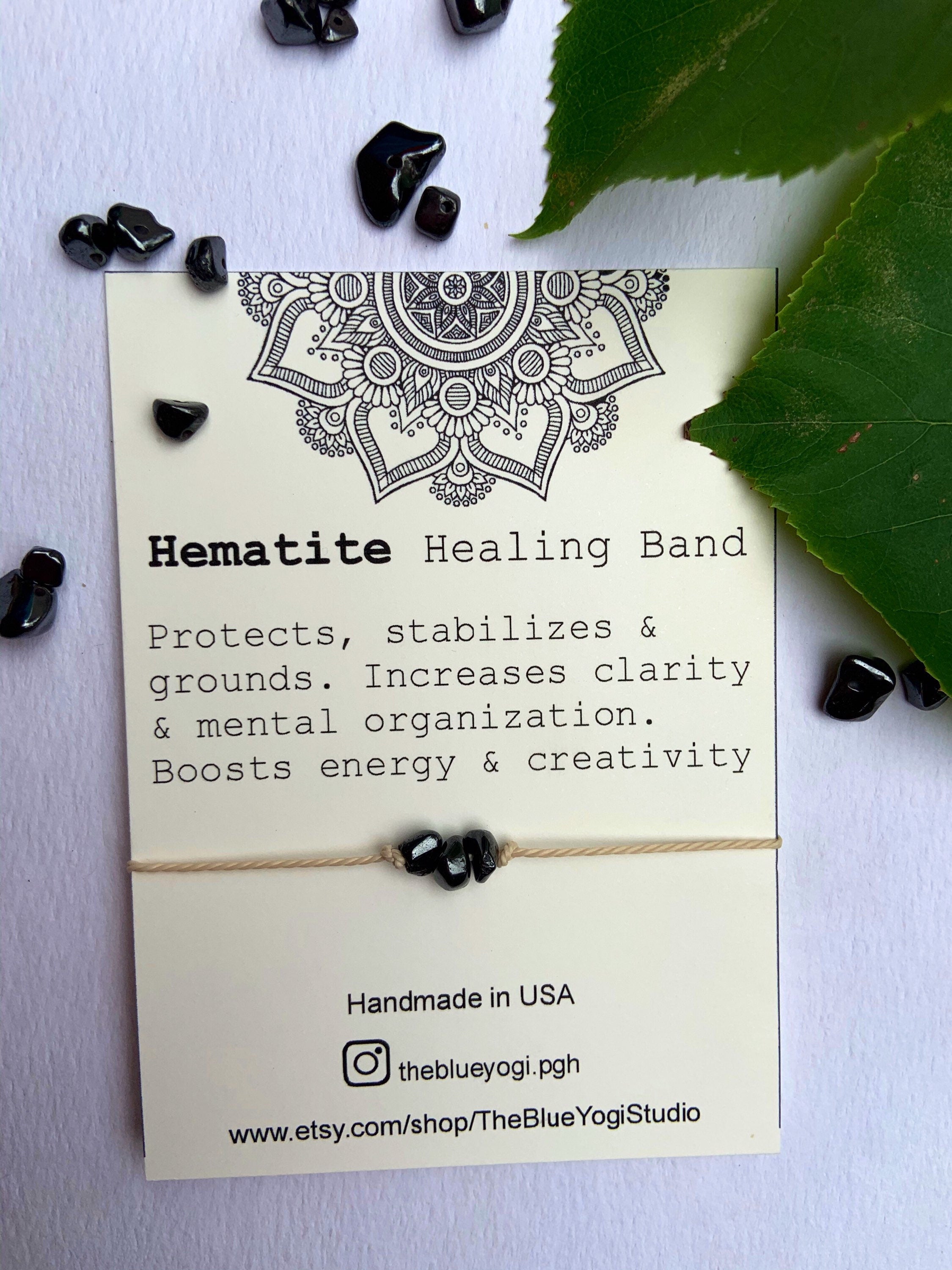 Hematite Healing Band featuring natural gemstones and a tie closure, displayed with a watercolor Mandala art card.