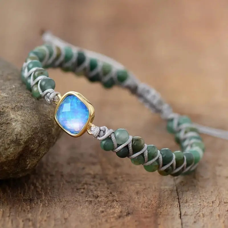 A beautifully crafted Jade Opal Charm Bracelet featuring genuine opal gemstones and jade beads, showcasing a bohemian style.
