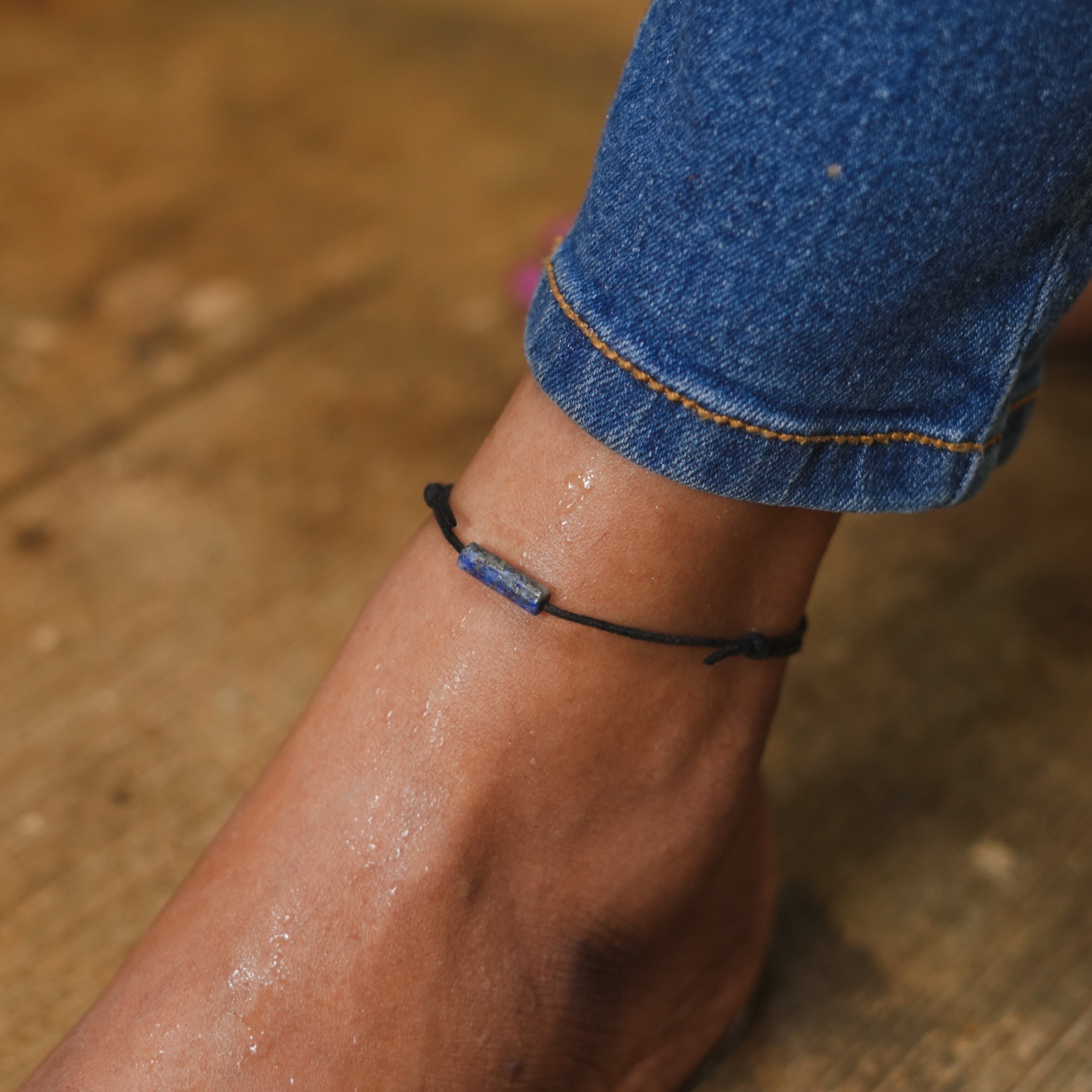 Lapis Lazuli Bar Minimal and Adjustable Anklet on a white background, showcasing its elegant design and sliding knot feature.