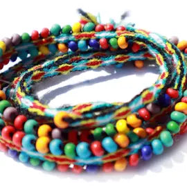 Colorful matte rainbow beaded tie wraps displayed elegantly, showcasing their versatility as bracelets, anklets, and choker necklaces.