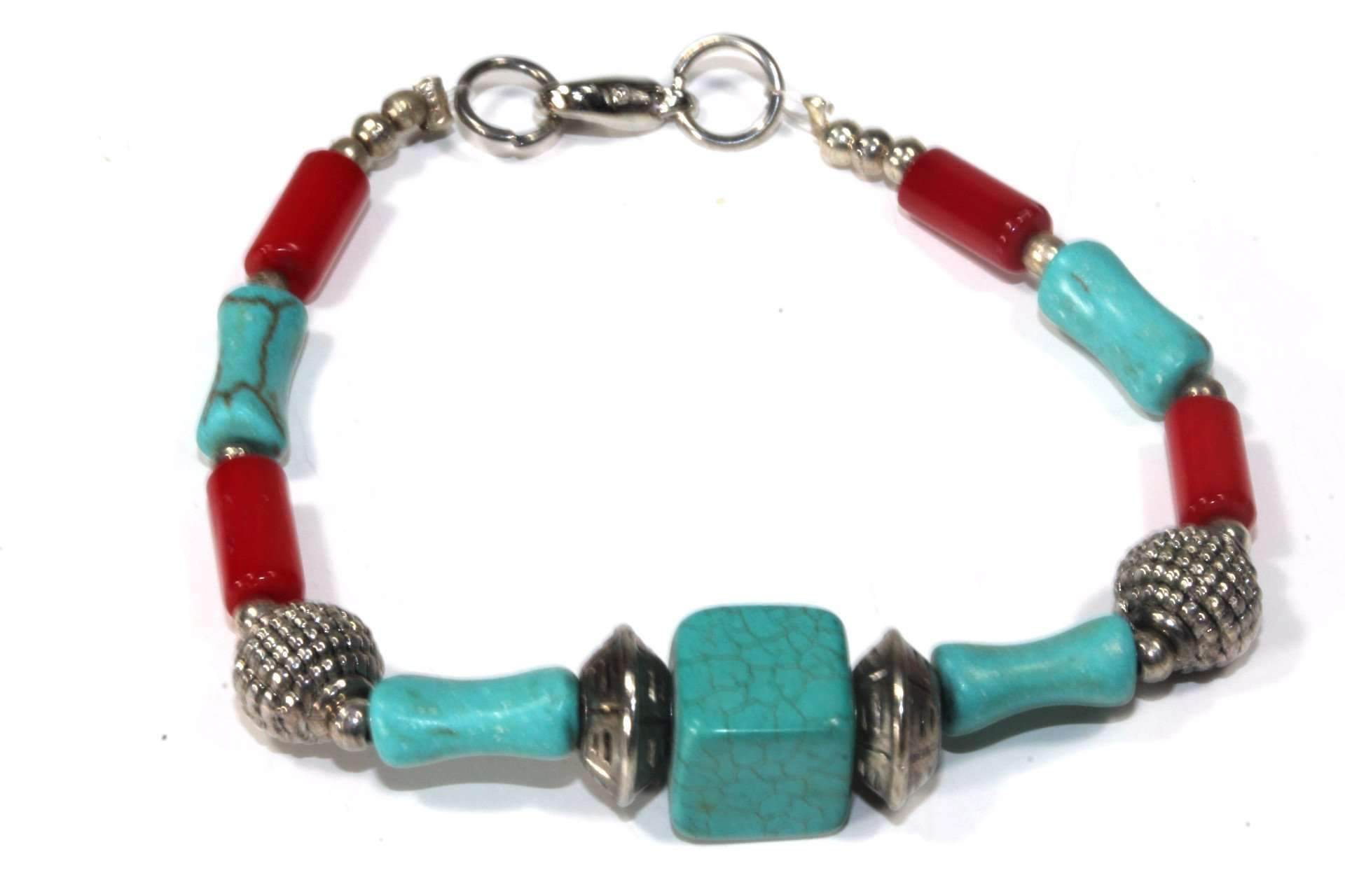Mozambique Tribal Resin Bracelet featuring colorful marbled turquoise and red beads with silver tone textured charms, showcasing a boho chic style.