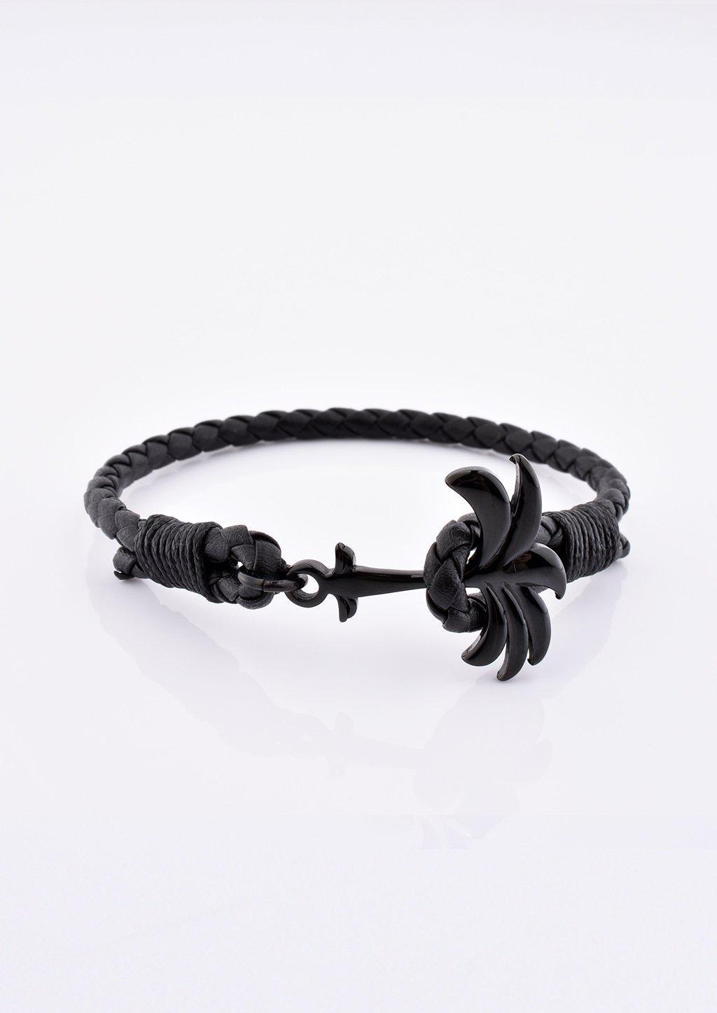 Palmband - Eclipse leather bracelet featuring a unique black palm tree design, showcasing luxury and style.