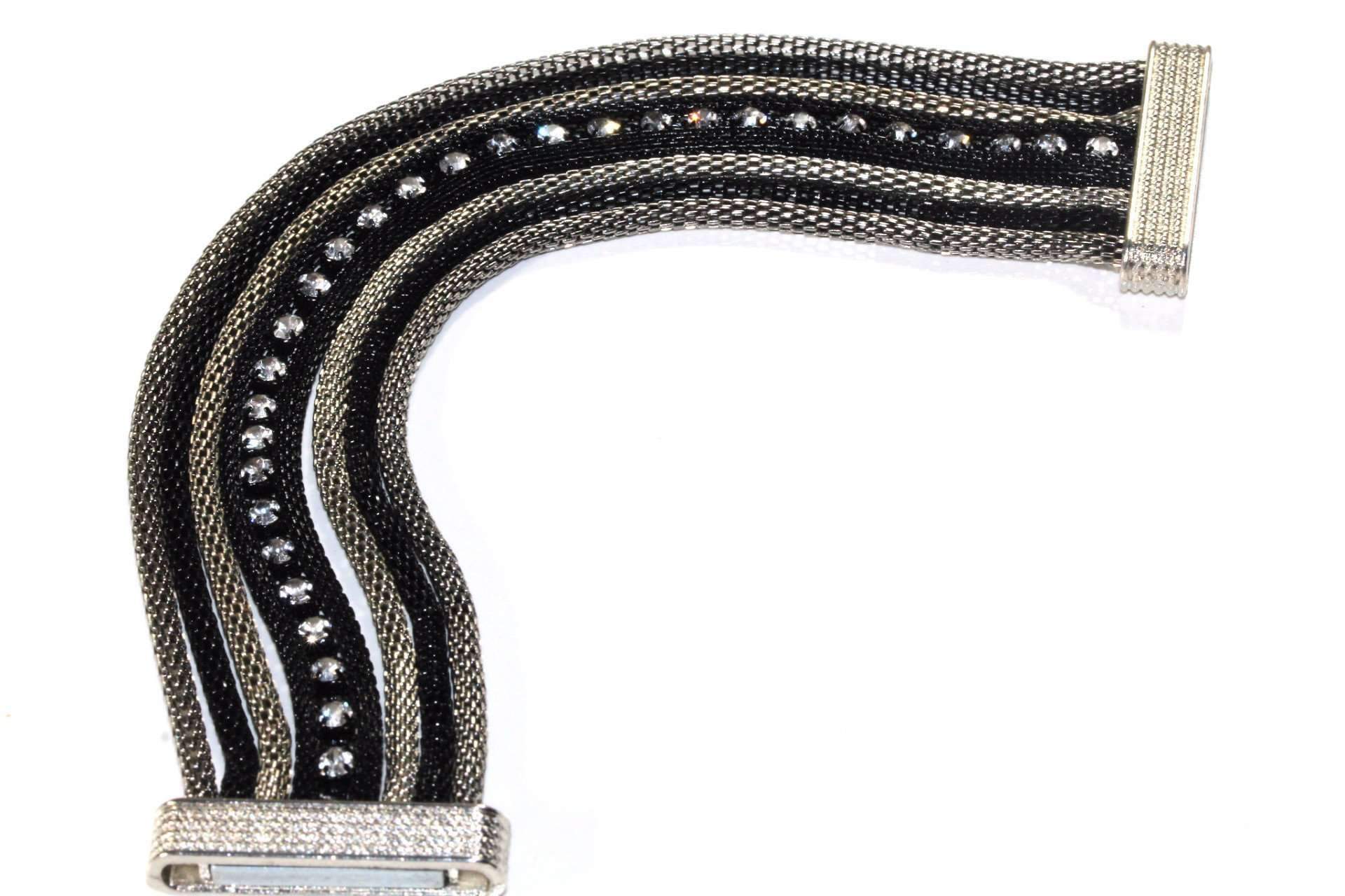 Rope Style Dazzling Cocktail Bracelet in black and silver tones with sparkling crystals and a magnetic clasp, elegantly draped over a wrist.