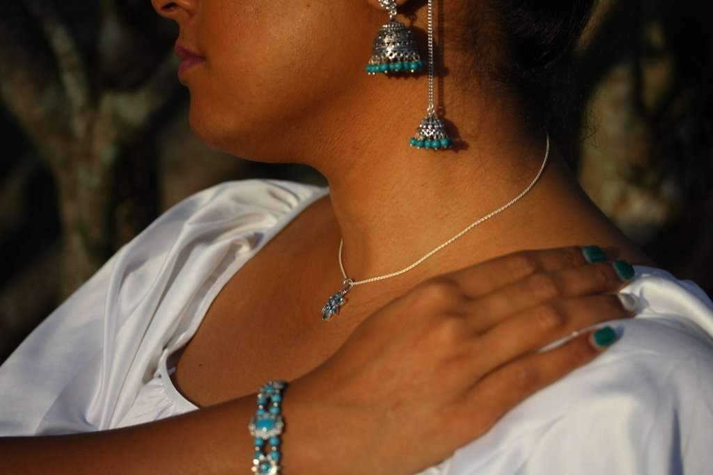 Sweet Sunflower Boho Bracelet featuring antique sunflower charms and colorful marbled beads on a silver-tone base.