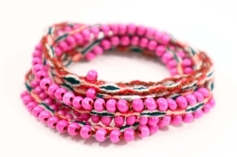 Washed Out Fuchsia Beaded Tie Wraps featuring handwoven alpaca blend textile and Czech beads, styled as a bracelet and choker.