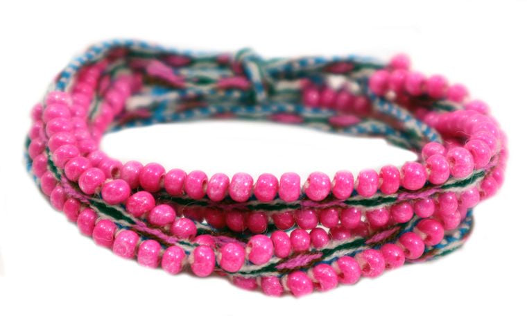 Washed Out Fuchsia Beaded Tie Wraps showcasing vibrant fuchsia and blue colors, handwoven alpaca blend textile, and Czech beads.