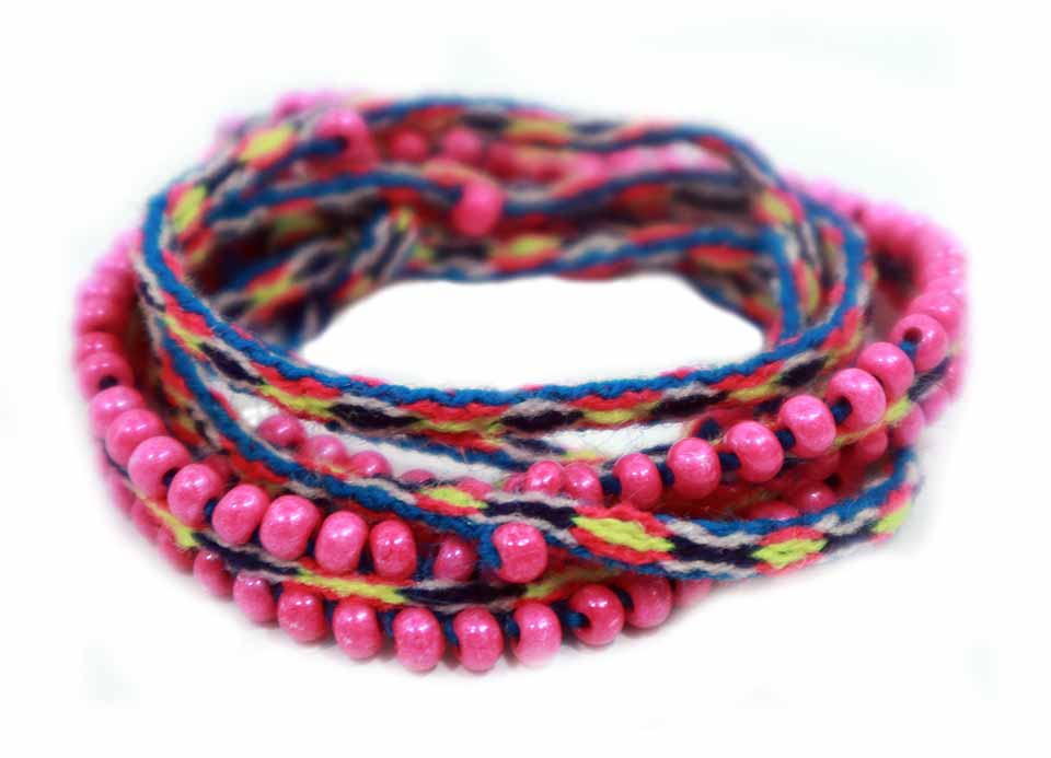 Washed Out Fuchsia Beaded Tie Wraps showcasing vibrant colors and handwoven textile, perfect for bracelets, anklets, and choker necklaces.
