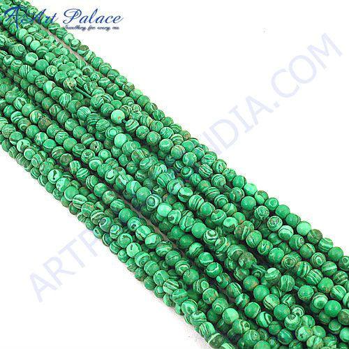 A collection of 100% genuine Malachite loose beads in various shapes and sizes, showcasing their vibrant green colors and unique patterns.