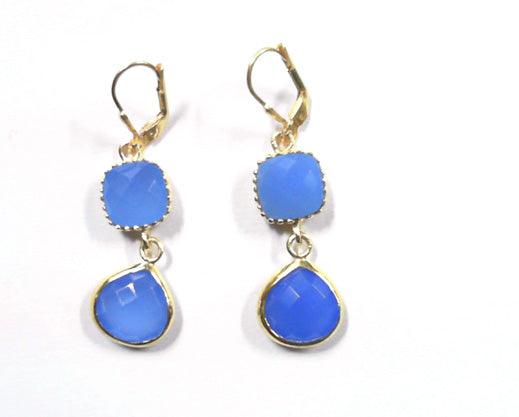 Elegant 925 silver earrings featuring blue chalcedony in cushion and pear shapes, showcasing a stunning design.