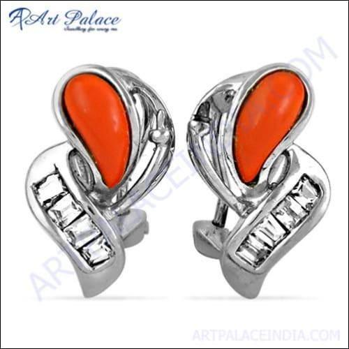 A pair of 925 silver earrings featuring genuine coral gemstones and sparkling cubic zirconia, showcasing oceanic elegance and handcrafted design.