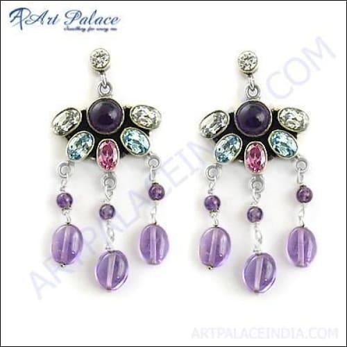 A pair of elegant 925 silver earrings featuring a checker cut pear lapis gemstone, showcasing a rich blue color and intricate design.