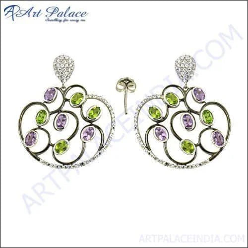 A pair of elegant 925 silver earrings featuring checker cut pear lapis gemstones, showcasing intricate designs and vibrant colors.