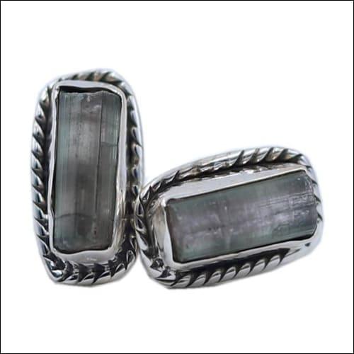 A pair of elegant 925 silver earrings featuring checker cut pear lapis gemstones, showcasing a deep blue color and artisanal craftsmanship.