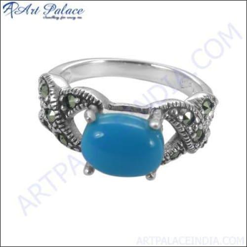 A pair of elegant 925 silver earrings featuring checker cut pear lapis gemstones, showcasing their unique design and vibrant blue color.