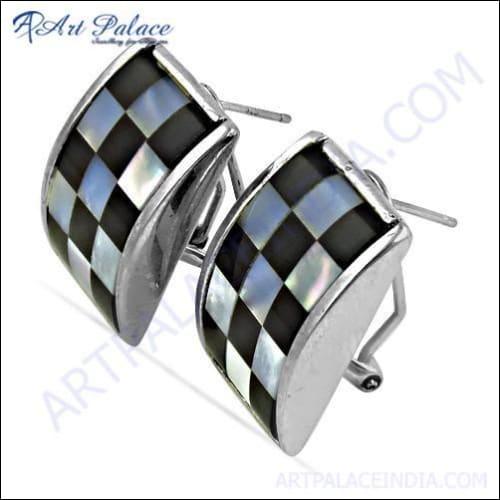 A pair of elegant 925 silver earrings featuring checker cut pear lapis gemstones, showcasing their unique design and vibrant color.