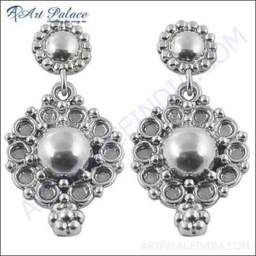 A pair of elegant 925 silver earrings featuring checker cut pear lapis gemstones, showcasing their unique design and rich color.