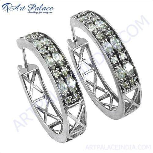 Elegant 925 silver earrings featuring sparkling designer cubic zirconia gemstones, showcasing a stylish and sophisticated design.