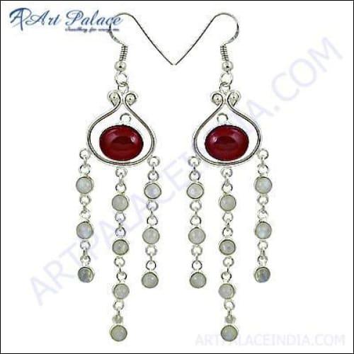 A pair of 925 silver earrings featuring a rainbow moonstone and red onyx, showcasing their vibrant colors and artisanal craftsmanship.