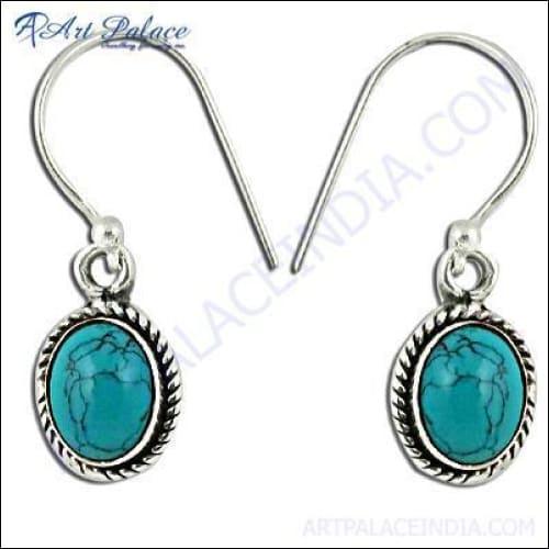 Elegant 925 silver earrings featuring vibrant synthetic turquoise gemstones, showcasing modern design and timeless elegance.