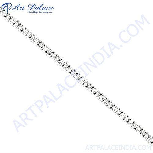 A collection of elegant 925 sterling silver chains displayed on a soft fabric background, showcasing their shine and intricate designs.