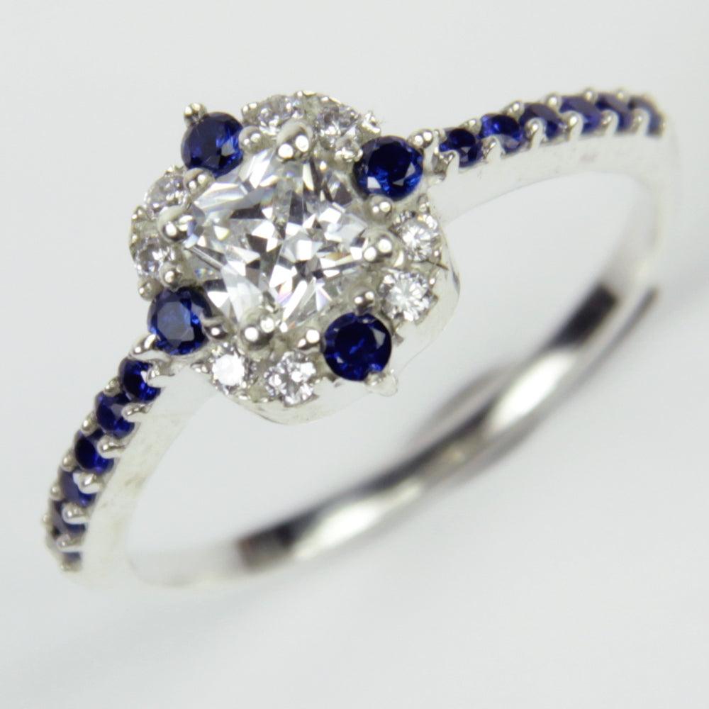 A stunning 925 Sterling Silver Cubic Zirconia Engagement Ring featuring sparkling stones and a polished band, symbolizing love and commitment.