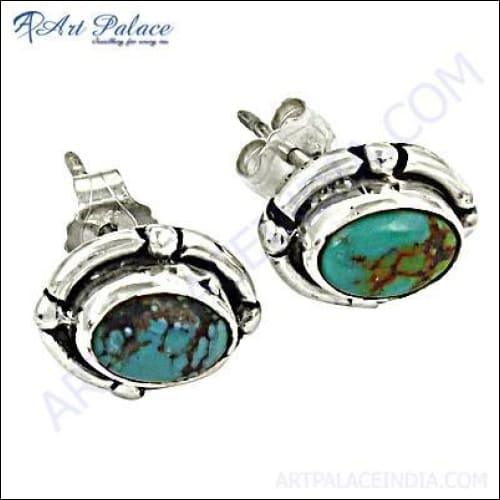 A pair of elegant 925 sterling silver earrings featuring vibrant turquoise gemstones, showcasing intricate design and craftsmanship.